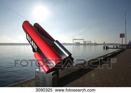 Stock Photography - Telescope in front of HDW dockyard, Kiel, Schleswig-Holstein, Germany . Fotosearch