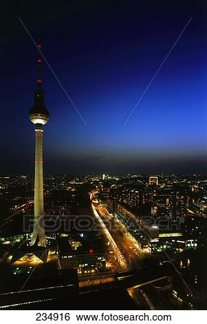 Stock Photograph - Television tower lit up at night, Alexanderplatz, Berlin, Germany . Fotosearch