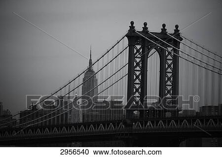 The Manhattan Bridge with the Empire State Building in the background, New York City, USA View Large Photo Image Stock Image - The Manhattan Bridge with the Empire State Building in the background, New York City, USA . Fotosearch