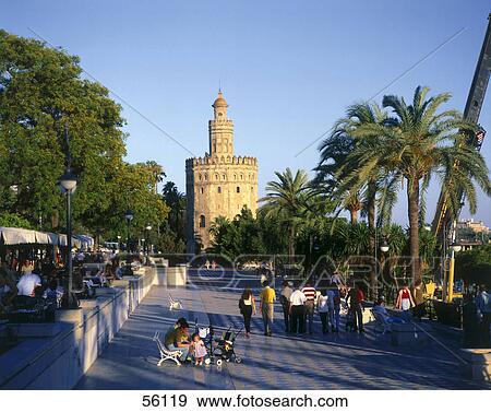 Stock Photo - Tourists at promenade, Torre del Oro, Seville, Spain . Fotosearch