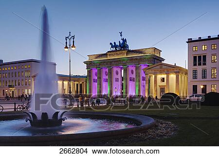 Picture - Tourists in front of gate at dusk, Brandenburg Gate, Berlin, Germany . Fotosearch