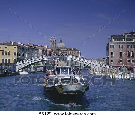 Stock Photo - Tourists on boat in canal, Grand Canal, Venice, Italy . Fotosearch