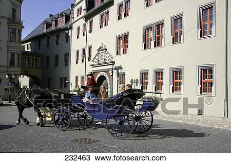 Tourists on horse drawn carriage, Weimar, Germany View Large Photo Image Stock Image - Tourists on horse drawn carriage, Weimar, Germany . Fotosearch