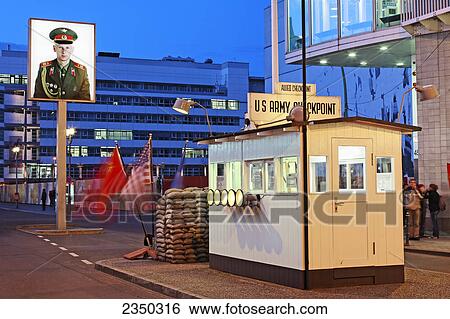 Stock Photograph - Tourists standing at checkpoint, Checkpoint Charlie, Berlin, Germany . Fotosearch