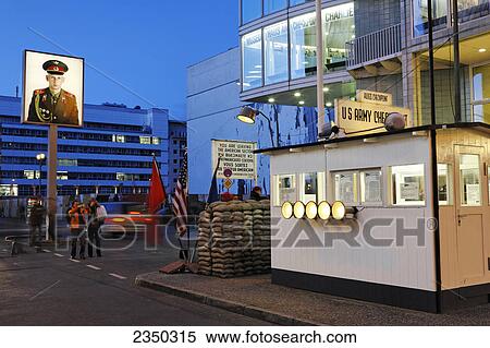 Stock Photography - Tourists standing at checkpoint, Checkpoint Charlie, Berlin, Germany . Fotosearch