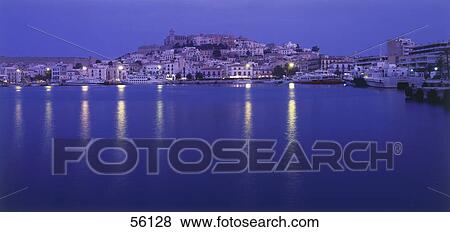 Stock Photo - Town at the waterfront lit up at night, Ibiza Dalt Vila Port, Spain . Fotosearch