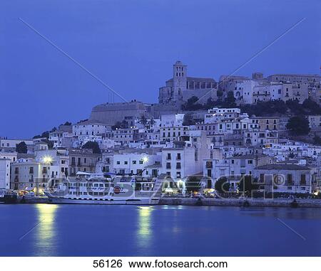 Town at waterfront lit up at night, Dalt Vila, Ibiza, Balearic Islands, Spain View Large Photo Image Stock Photograph - Town at waterfront lit up at night, Dalt Vila, Ibiza, Balearic Islands, Spain . Fotosearch
