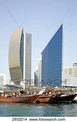 Traditional sailing vessels in front of Dubai skyline, United Arab Emirates View Large Photo Image Picture - Traditional sailing vessels in front of Dubai skyline, United Arab Emirates . Fotosearch