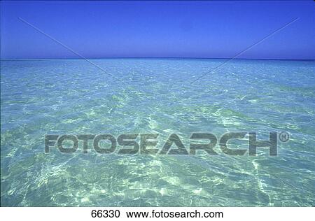 Stock Image - Turquoise water of Caribbean sea . Fotosearch
