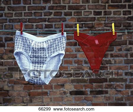 Stock Photo - Two underwear's hanging from clothesline . Fotosearch
