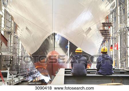 Two workers and ferrry un dockyard, Flensburg, Schleswig-Holstein, Germany View Large Photo Image Stock Photo - Two workers and ferrry un dockyard, Flensburg, Schleswig-Holstein, Germany . Fotosearch