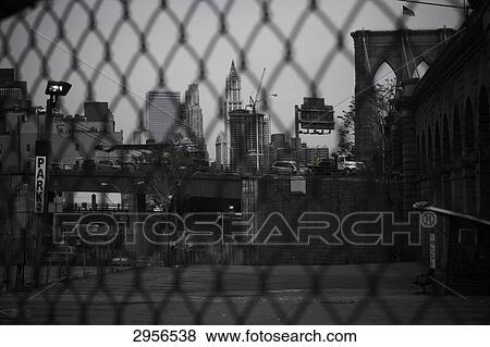 View through a wire mesh fence on a parking spot in Brooklyn, New York City, USA View Large Photo Image Stock Photo - View through a wire mesh fence on a parking spot in Brooklyn, New York City, USA . Fotosearch