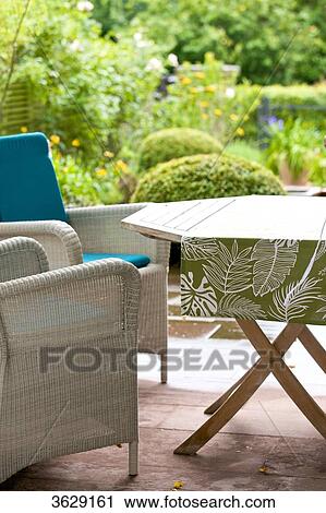 Wicker chairs and table on terrace View Large Photo Image Stock Image - Wicker chairs and table on terrace . Fotosearch