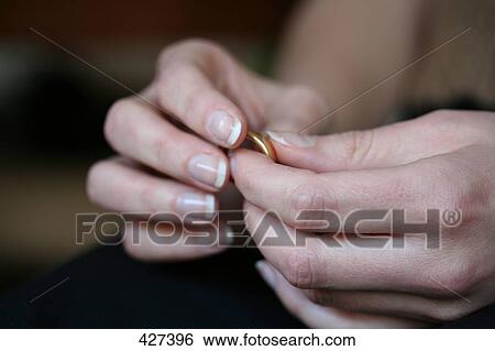 Woman holding ring, close-up View Large Photo Image Stock Photograph - Woman holding ring, close-up . Fotosearch