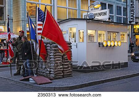 Woman posing with policeman at checkpoint, Checkpoint Charlie, Berlin, Germany View Large Photo Image Stock Image - Woman posing with policeman at checkpoint, Checkpoint Charlie, Berlin, Germany . Fotosearch