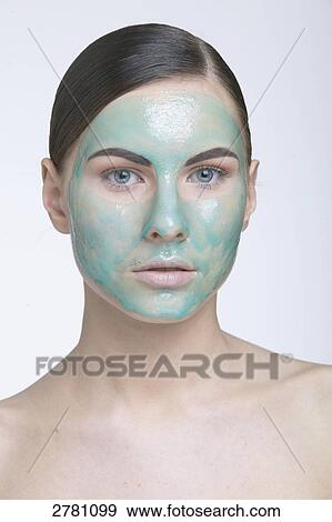 Stock Photo - woman wearing a face mask, portrait . Fotosearch