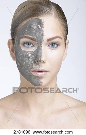 Stock Photograph - woman wearing a face mask, portrait . Fotosearch