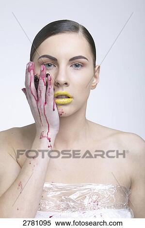 Stock Photography - woman wrapped in foil, portrait . Fotosearch