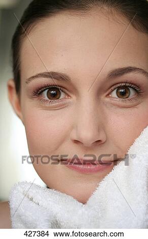 Picture - Young woman looking at camera, portrait . Fotosearch