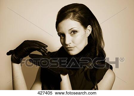 Stock Photography - Young woman wearing gloves . Fotosearch