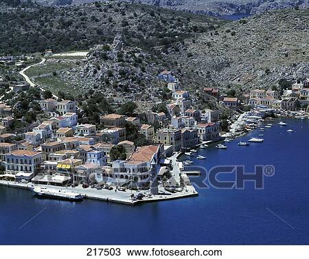 Aerial view of city at coast, Dodecanese Islands, Greece View Large Photo Image Stock Image - Aerial view of city at coast, Dodecanese Islands, Greece . Fotosearch