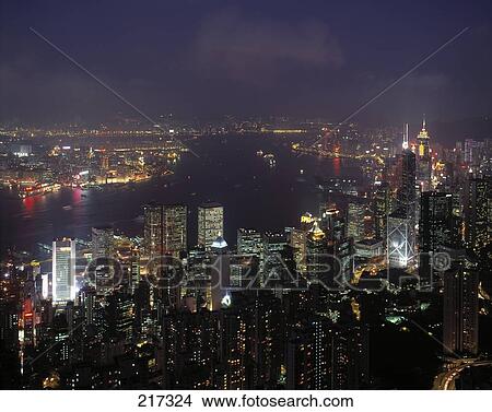 Aerial view of city lit up at night, China View Large Photo Image Picture - Aerial view of city lit up at night, China . Fotosearch