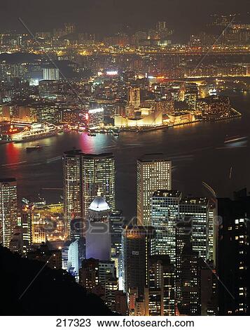 Stock Image - Aerial view of city lit up at night, China . Fotosearch