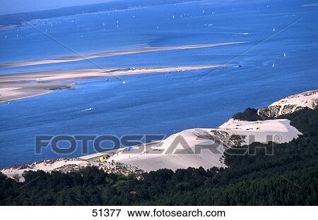 Aerial view of sand dune, Dune of Pilat, Bassin d' Arcachon, Gironde, France View Large Photo Image Stock Photo - Aerial view of sand dune, Dune of Pilat, Bassin d' Arcachon, Gironde, France . Fotosearch
