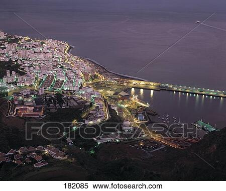 Aerial view of town at coast lit up at night, La Palma, Canary Islands, Spain View Large Photo Image Stock Photography - Aerial view of town at coast lit up at night, La Palma, Canary Islands, Spain . Fotosearch