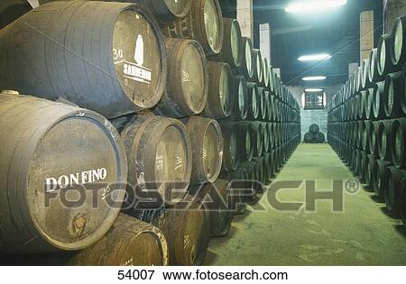 Stock Photo - Barrels of wine inside wine cellar, Jerez De La Frontera, Andalusia, Spain . Fotosearch
