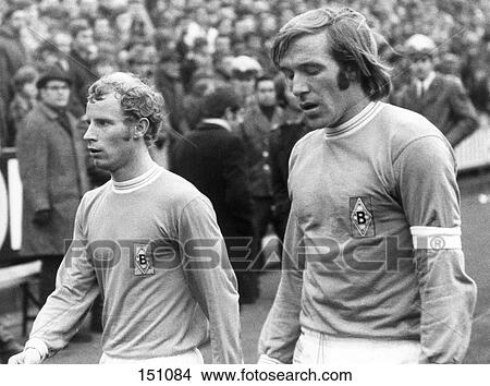 Berti Vogts and Guenther Netzer walking in stadium, Boekelberg, Germany View Large Photo Image Picture - Berti Vogts and Guenther Netzer walking in stadium, Boekelberg, Germany . Fotosearch