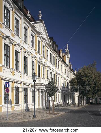 Stock Photo - Bicycles in front of building in street . Fotosearch