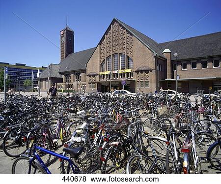 Stock Photo - Bicycles parked in front of building . Fotosearch