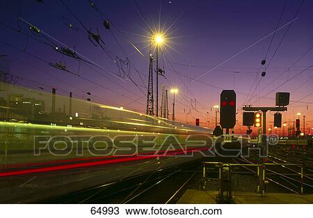 Blurred view of train leaving railway station, Germany View Large Photo Image Stock Image - Blurred view of train leaving railway station, Germany . Fotosearch