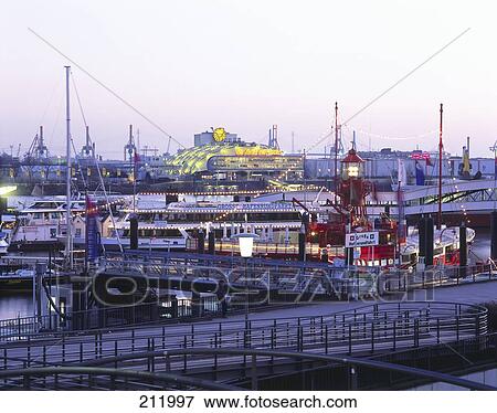 Boats at harbor in city, Hamburg, Germany View Large Photo Image Stock Photo - Boats at harbor in city, Hamburg, Germany . Fotosearch