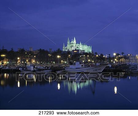 Boats in river with cathedral lit up in background, Balearic Islands, Spain View Large Photo Image Stock Image - Boats in river with cathedral lit up in background, Balearic Islands, Spain . Fotosearch