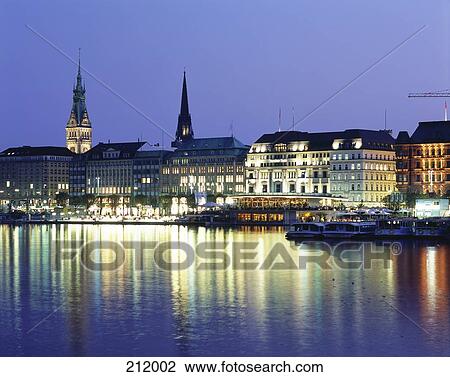 Boats in river with lit up buildings in background, River Alster, Hamburg, Germany View Large Photo Image Stock Image - Boats in river with lit up buildings in background, River Alster, Hamburg, Germany . Fotosearch