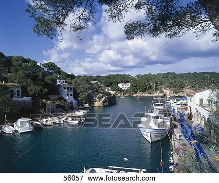 Stock Photo - Boats in the river under cloudy sky, Mallorca, Balearic Islands, Spain . Fotosearch