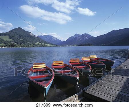 Boats moored at pier, Bavaria, Germany View Large Photo Image Stock Photo - Boats moored at pier, Bavaria, Germany . Fotosearch
