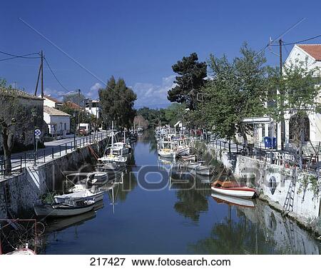 Stock Photo - Boats moored in canal . Fotosearch