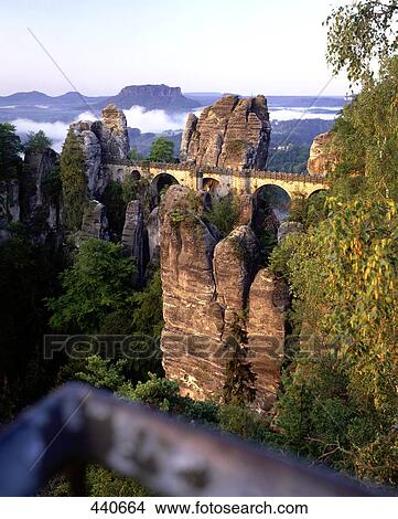 Bridge passing through cliffs, Bastei Bridge, Saxon Switzerland National Park, Dresden, Saxony, Germany View Large Photo Image Picture - Bridge passing through cliffs, Bastei Bridge, Saxon Switzerland National Park, Dresden, Saxony, Germany . Fotosearch