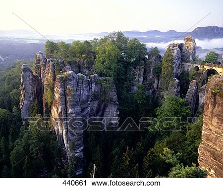 Bridge passing through cliffs, Bastei Bridge, Saxon Switzerland National Park, Dresden, Saxony, Germany View Large Photo Image Stock Image - Bridge passing through cliffs, Bastei Bridge, Saxon Switzerland National Park, Dresden, Saxony, Germany . Fotosearch