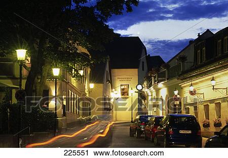 Stock Image - Buildings along street lit up at night, Vienna, Austria . Fotosearch