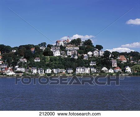 Stock Image - Buildings at waterfront, River Elbe, Suelberg, Hamburg, Germany . Fotosearch