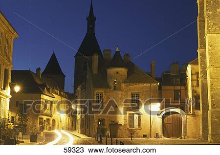 Stock Image - Buildings in town illuminated at night, Avallon, Burgundy, France, Europe . Fotosearch