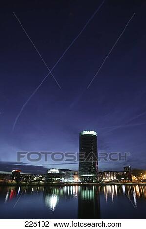 Stock Image - Buildings lit up at night, Frankfurt, Hesse, Germany . Fotosearch