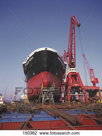 Stock Image - Bulk container ship on dock, Hamburg, Germany . Fotosearch