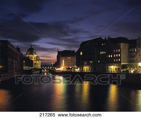 Stock Photography - Canal flowing through city at night, Berlin . Fotosearch