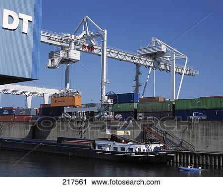 Cargo containers and crane at harbor, Ruhrort, Duisburg, North Rhine-Westphalia, Germany View Large Photo Image Stock Image - Cargo containers and crane at harbor, Ruhrort, Duisburg, North Rhine-Westphalia, Germany . Fotosearch