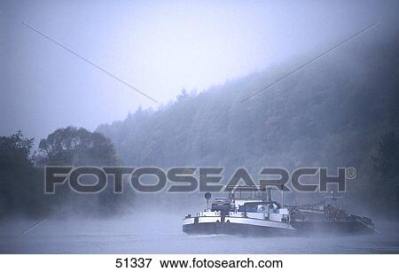 Stock Photo - Cargo ship in river, River Neckar, Heidelberg, Germany . Fotosearch